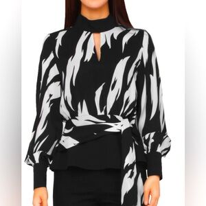 Women's zebra print peplum shirt by Gracia Fashion, NYC, size M.